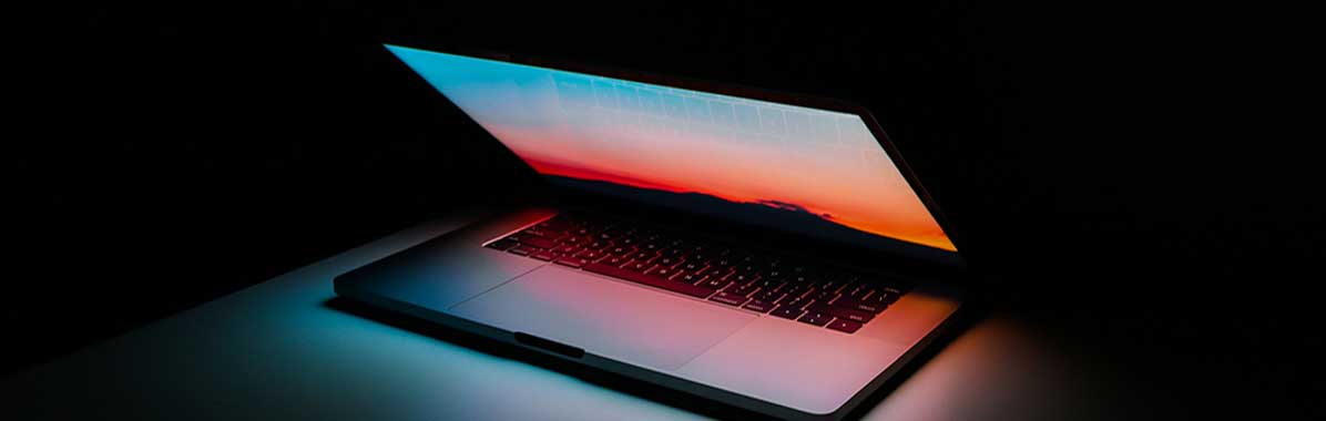 laptop open with dark background