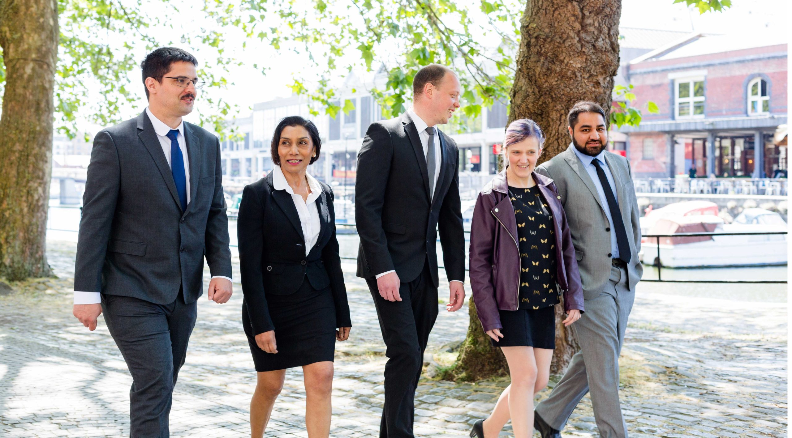 Men and women walking in business attire